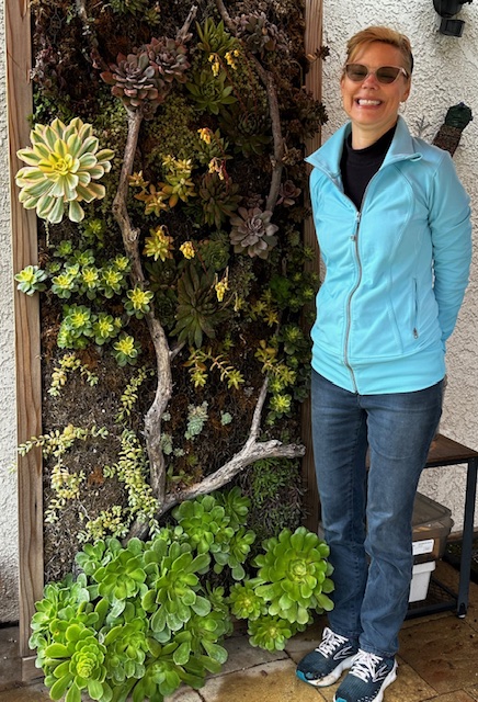 Laurie and her amazing succulent wall