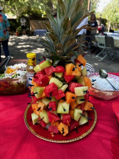 A clever fruit creation - a pineapple tree with melon picks