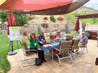 Jean shows off our new Plant-A-Tree donation chart