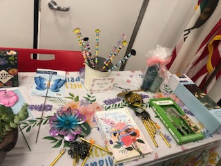 The fundraising team provided a table of prizes for bingo game winners