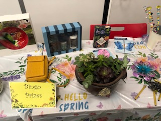 The fundraising team provided a table of prizes for bingo game winners