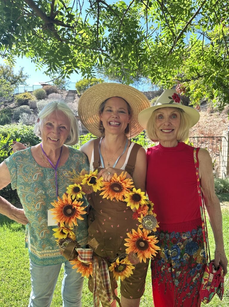 Pam and Laurie admire Marilyn's beautiful wreath